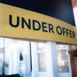 ,'under,Offer',Sign,Outside,Street,Of,Houses